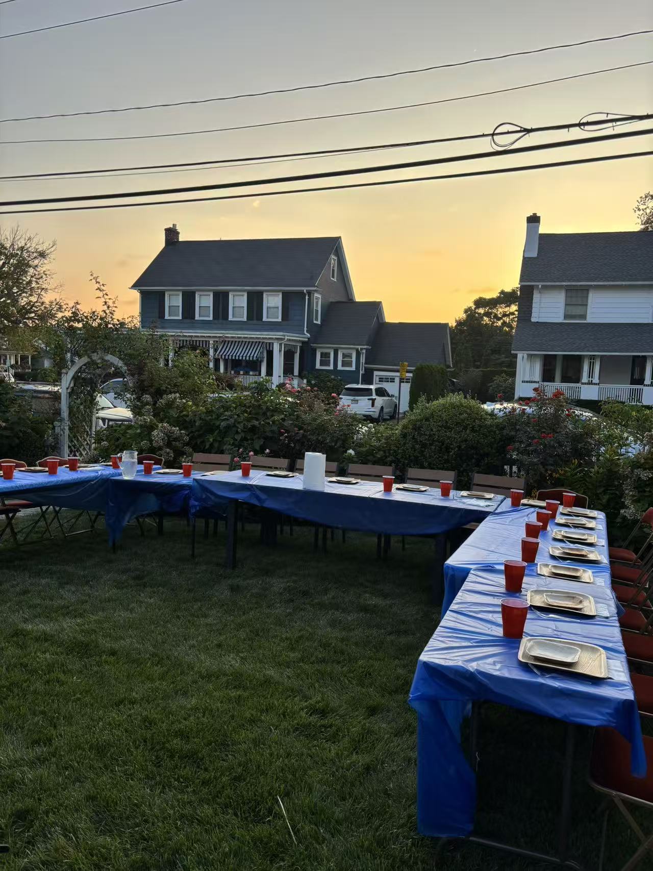 Sunset backyard hibachi dinner tables