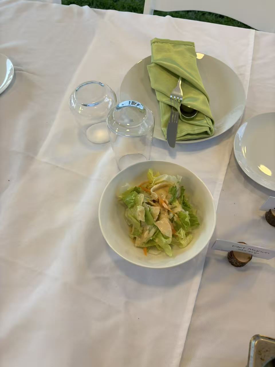 Plated fresh salad course with green napkin